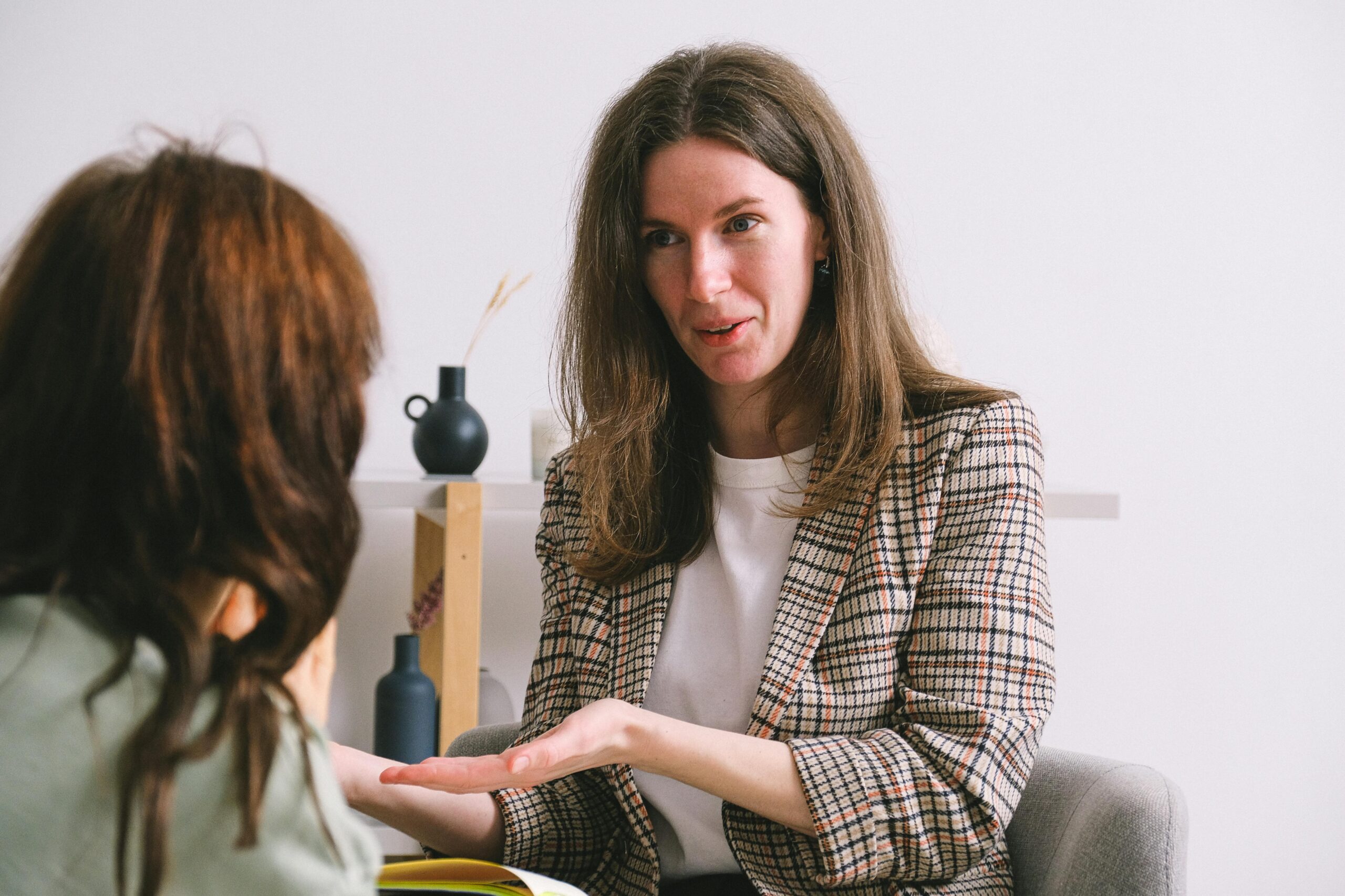 A therapist is chatting with a client