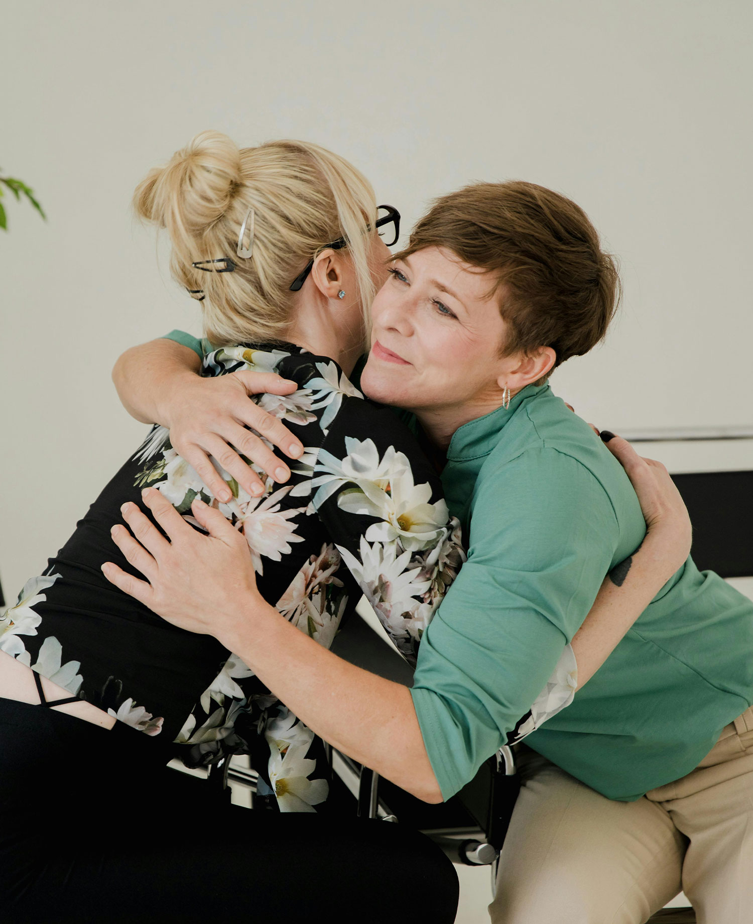 Two women hug